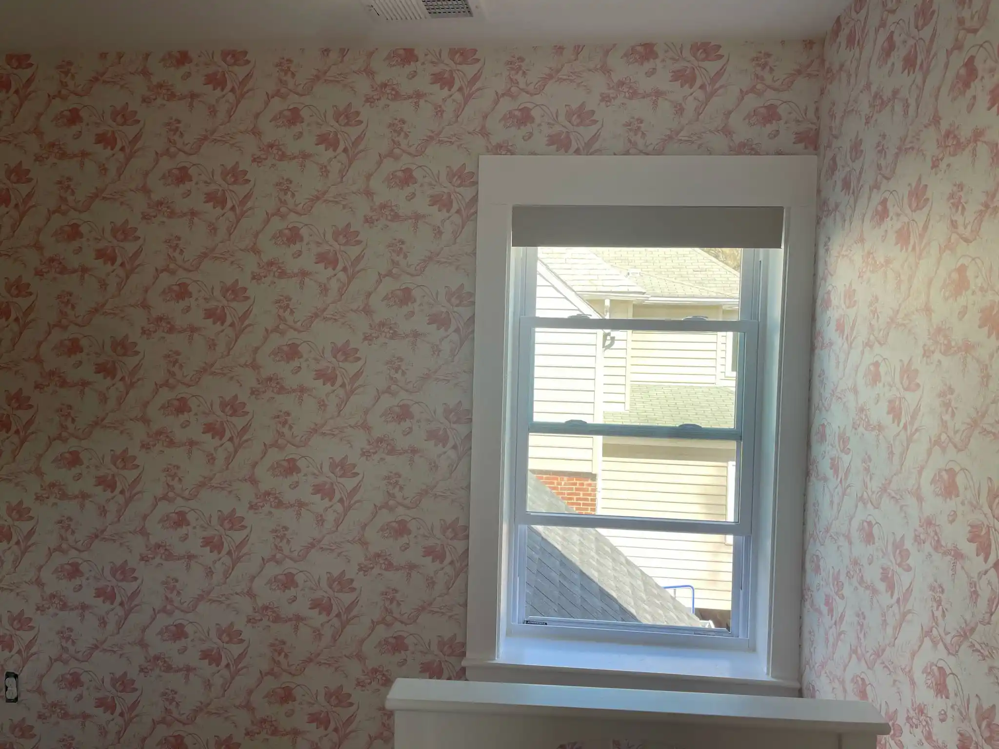 Professional wallpaper installer at work in San Diego